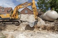 Excuvating chalk to form a trench for a plastic tank Royalty Free Stock Photo