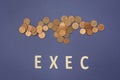 Exec written with wooden letters on a blue background