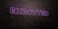 EXECUTED -Realistic Neon Sign on Brick Wall background - 3D rendered royalty free stock image