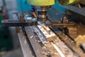 Execution of the work process on an industrial milling machine. The metal part is clamped in the collet. The cutter makes a Royalty Free Stock Photo