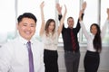 Executive asian boss with his successful business team at background Royalty Free Stock Photo