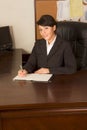 Executive assistant woman in business suit writing Royalty Free Stock Photo