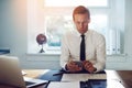 Executive business man texting on his phone Royalty Free Stock Photo