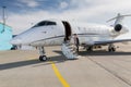 A executive business woman leaving a plane Royalty Free Stock Photo