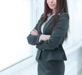 Executive business woman standing near window in spacious office. Royalty Free Stock Photo