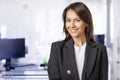 Executive business woman wearing business casual and standing at the office Royalty Free Stock Photo