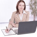 Executive business woman writing on a blak sheet.