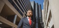 Executive businessman. Portrait of ceo near modern office in suit. Happy leader standing in front of company building. Royalty Free Stock Photo