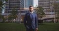 Executive businessman. Portrait of ceo near modern office in suit. Happy leader standing in front of company building. Royalty Free Stock Photo