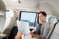 Executive businesswoman work laptop car backseat