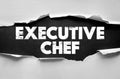 Executive Chef phrase presented through torn paper effect with rustic typography. Background theme for food, cooking, culinary Royalty Free Stock Photo