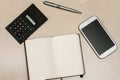 Executive Desk Tools, Messy Businessman, Open Executive Notebook, Touch Screen Devices and Stationery On A White Wooden Surface,