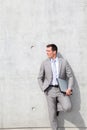 Executive leaningn on concrete wall Royalty Free Stock Photo