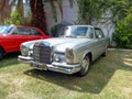 Executive luxury 1960s Mercedes Benz 300 SE coupe W112 in a park. CADEAA 2023 classic car show. Royalty Free Stock Photo