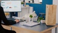 Executive manager carrying paper bag with takeaway food lunch order putting on desk Royalty Free Stock Photo