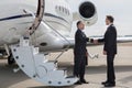 Executive manager leaving corporate jet