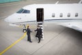 Executive manager leaving corporate jet