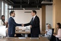 Executive manager shaking hand of successful employee at meeting Royalty Free Stock Photo