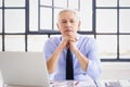 Executive senior businessman working on his laptop while sitting at desk at the office Royalty Free Stock Photo