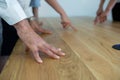 Executive standing with there hands on table during meeting