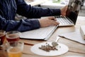 Executive working on laptop at coffee shop