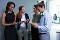 Executives using mobile phone in the office Royalty Free Stock Photo