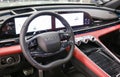 EXEED RX steering wheel and dashboard. Beige leather car interior. Vehicle interior SUV car. Modern car interior.
