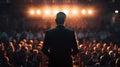 An exeive stands in front of a large audience delivering a powerful speech with confidence and conviction in their words Royalty Free Stock Photo