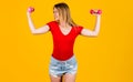 Exercise for arms. Sporty girl with dumbbells. Fitness woman working out. Strength and motivation. Royalty Free Stock Photo