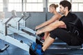 Exercise is better with a partner. a young athlete working out in the gym. Royalty Free Stock Photo