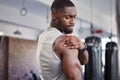 Exercise, black man and shoulder pain for training, fitness and workout for wellness in gym. Nigerian male, athlete and