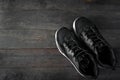 Exercise Black Shoes on wooden table background