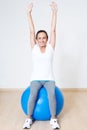 Exercise on a blue medicine ball