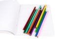 Exercise book with colorful pencils Royalty Free Stock Photo
