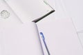 white exercise book with a blue pen. Royalty Free Stock Photo