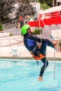 Athletic Young Man Climbing A Rope