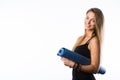 Exercise fitness woman ready for workout standing holding yoga mat isolated on white background. Sporty fit beautiful Royalty Free Stock Photo