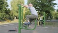 Exercise gyms in the open air. child has a simulator.