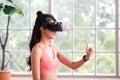 Exercise at home, e sport, Happy asian girl playing vr while workout fitness, Healthy asia woman wearing virtual reality headset Royalty Free Stock Photo