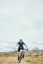 Exercise, man and cycling for fitness, bike and training with wellness, helmet for safety and health. Male person Royalty Free Stock Photo