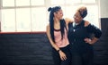 Exercise is more bare able with friends. two cheerful young women having a conversation before a workout session in a Royalty Free Stock Photo
