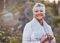 Exercise, music and portrait of a senior woman outdoor with earphones and towel for fitness in nature. Elderly female in Royalty Free Stock Photo