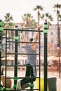 Exercise in the open air in the gymnasium on the beach barceloneta on the shores of the Mediterranean Sea in Catalonia