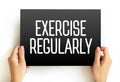 Exercise Regularly text on card, concept background