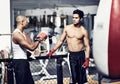 Exercise, talking and fighter in gym with coach for training, self defense or combat training. Fitness, sports or boxing