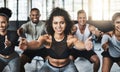 Exercise is too beneficial not to be doing it. a group of young people doing squats together during their workout in a Royalty Free Stock Photo