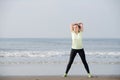 Exercise woman smiling at the beach Royalty Free Stock Photo