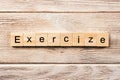 Exercise word written on wood block. exercise text on table, concept