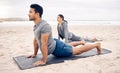 Exercise, yoga and wellness with a couple on the beach for a mental health or awareness workout in the morning. Fitness Royalty Free Stock Photo