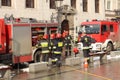 Exercises fire brigade in the old part of the city in the winter. Elimination of fire and natural disasters. Emergency response se Royalty Free Stock Photo